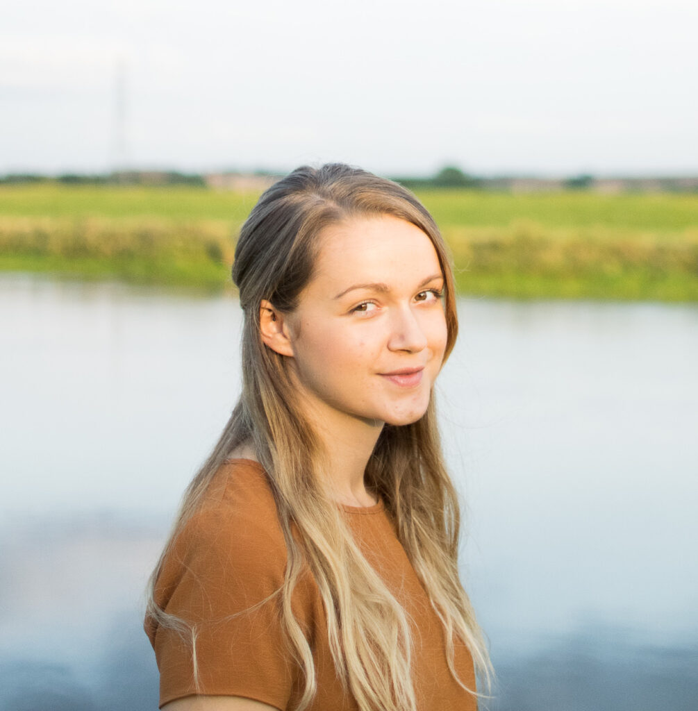 Woman standing by river